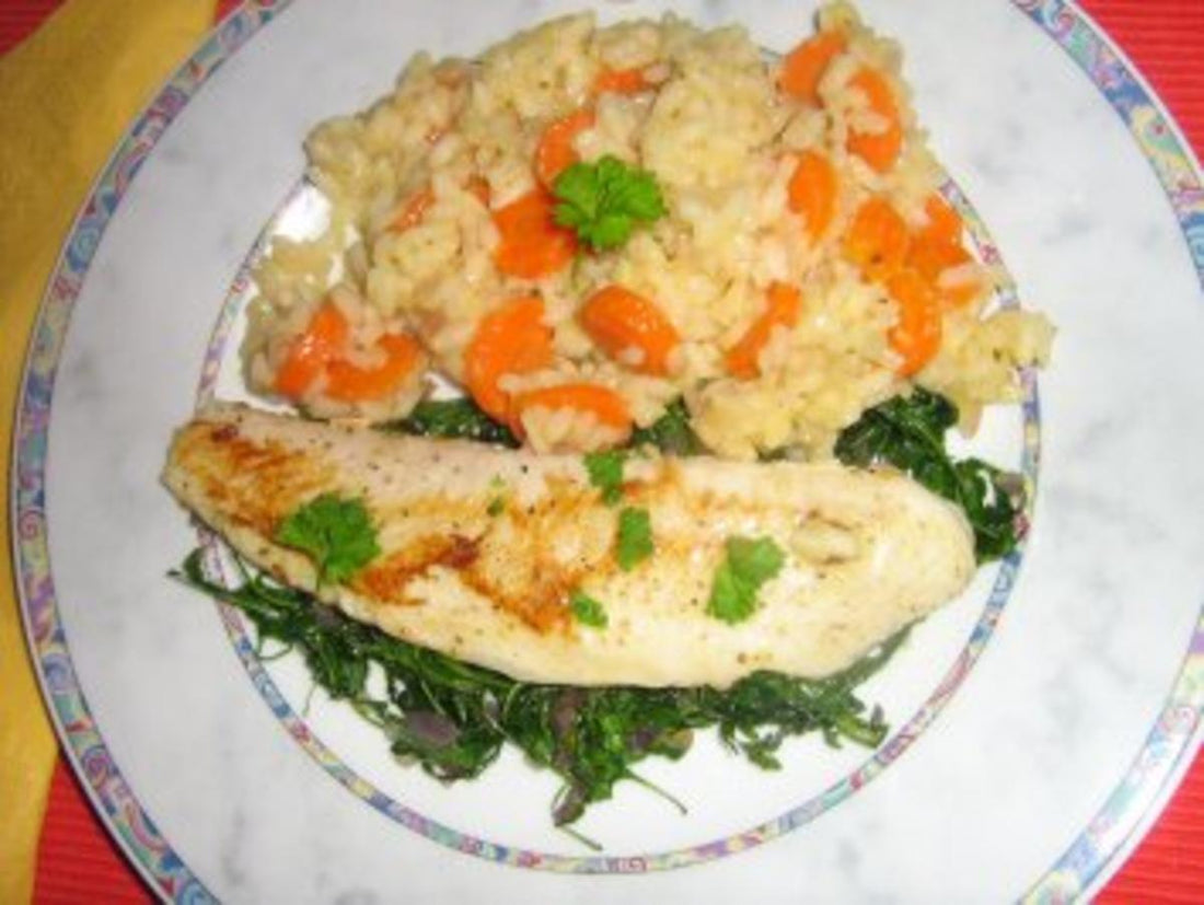 Pangasius auf Rucolabett an Gemüserisotto