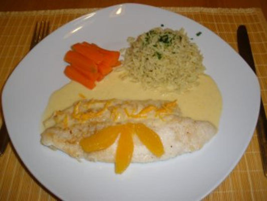 Fisch Pangasius in Orangensoße